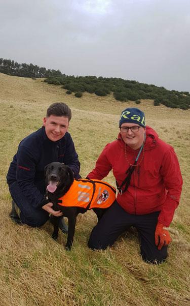 Ross Pringle and his stepdad, with their mountain rescue dog, Evie