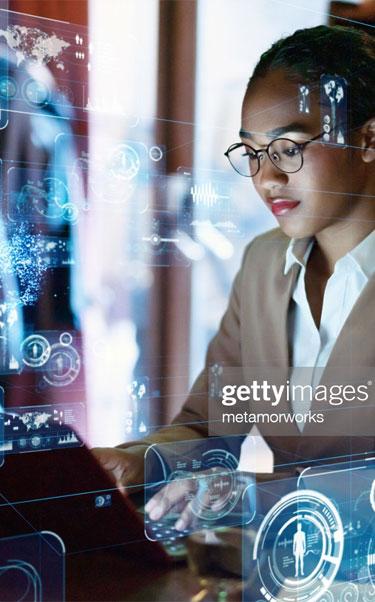 Young female engineer working at laptop