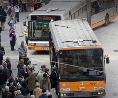 Buses collecting people at a bus terminal