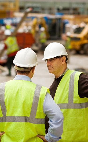 Engineers talk to each other on a construction site