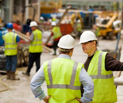 Engineers talking on a construction site
