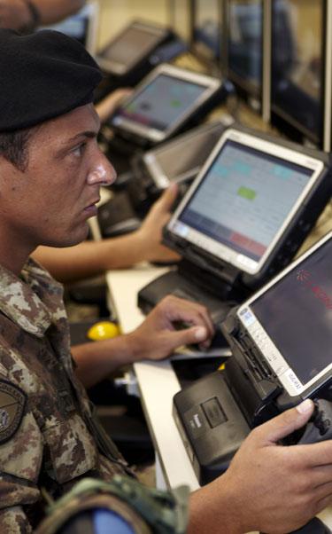 Military intelligence officer checking screens