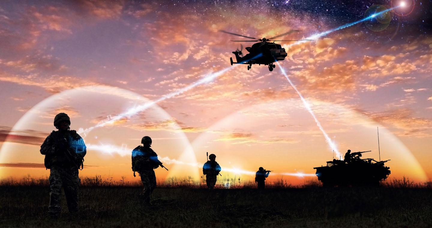 Silhouette of soldiers, helicopter and tank on a battlefield