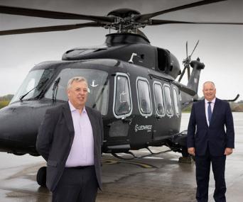 Norman Bone and Nick Whitney stand by the Leonardo AW149 helicoptet