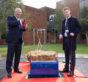 Nick Whitney and Jordan Goble bury the time capsule at the Yeovil site
