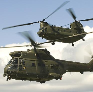 In close formation, a Royal Air Force Chinook (top) and Puma helicopter fly together in a shot entered for the RAF Photographic Competition of 2008.