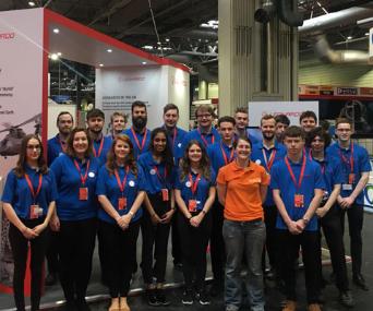Team of young Leonardo STEM Ambassadors of varying genders and ethnicities standing together at Big Bang Fair