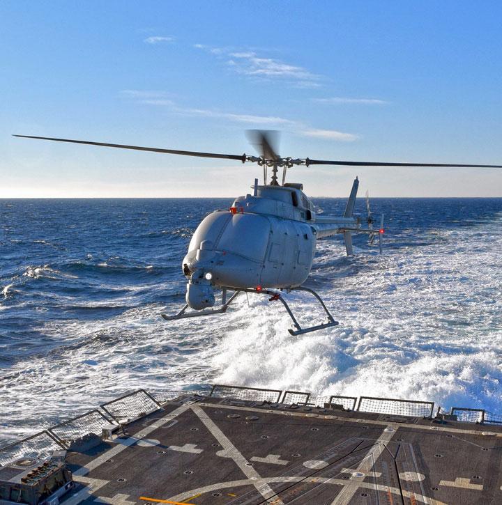 Fire Scout unmanned helicopter coming in to land on the back of a ship