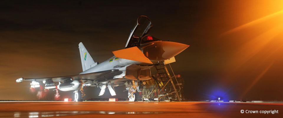 Night shot of a Typhoon lit up while on the tarmac 