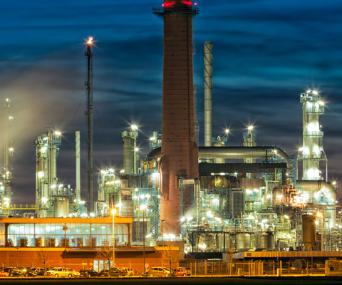 Oil refinery lit up at night