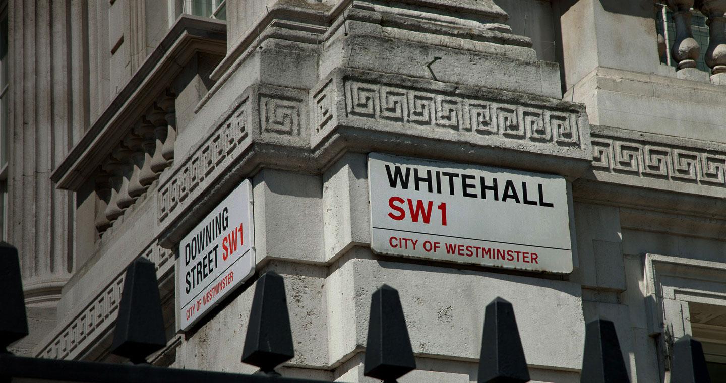 Corner of Whitehall with sign showing Whitehall and Downing Street